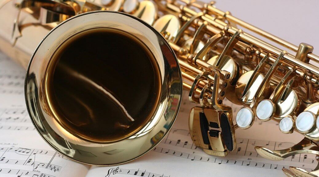 Most In-Demand Items Pawn Shops Want in 2021. Saxophone lying on top of sheet music